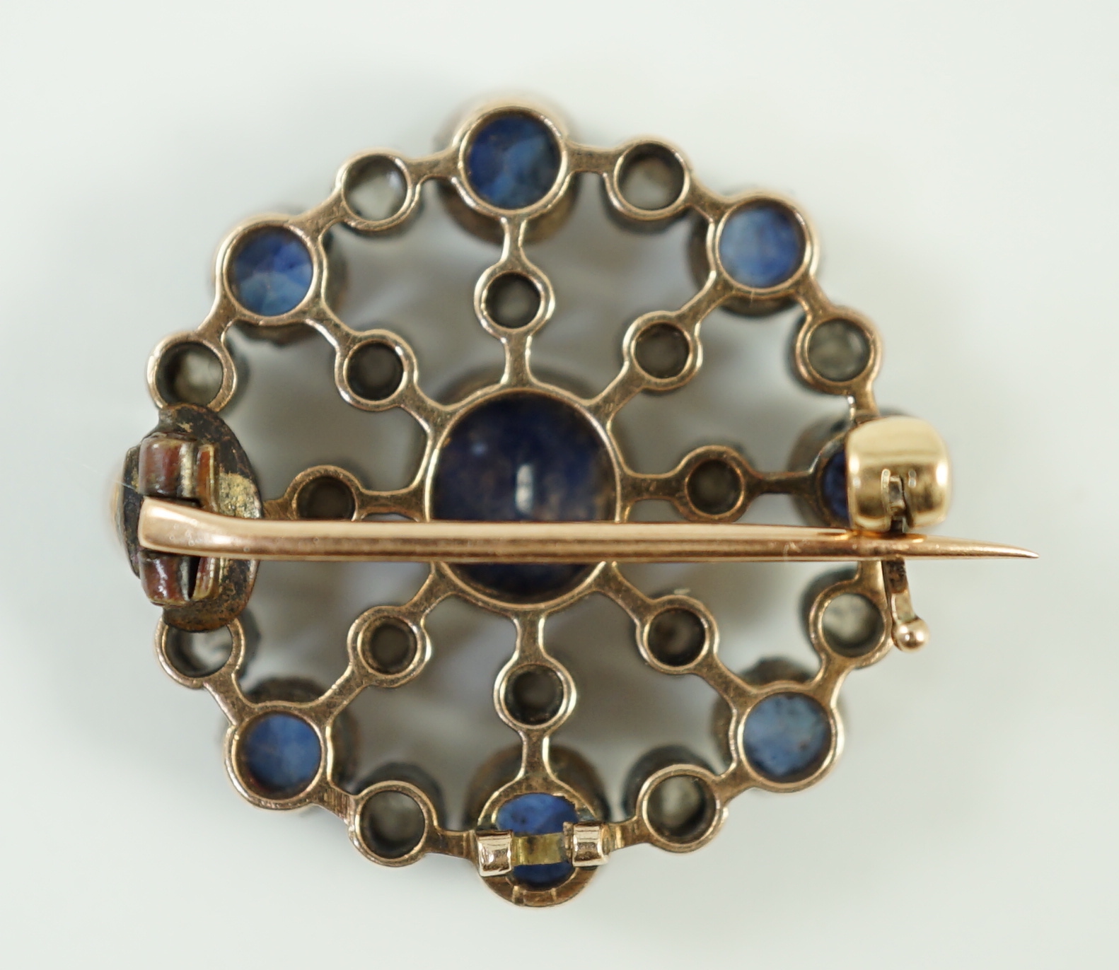 A Belle Epoque gold and silver, sapphire and diamond cluster set circular brooch